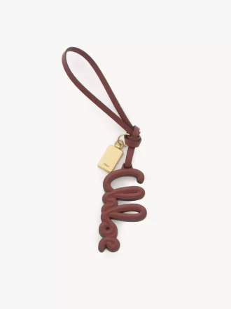 Logo bag charm in shiny leather