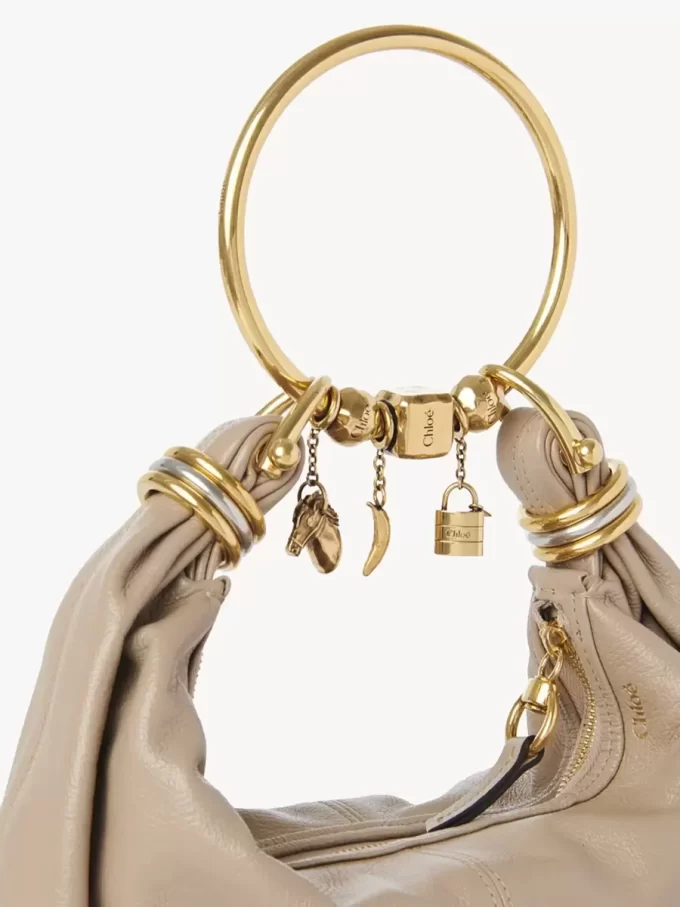 Sphere Dice bracelet charm in brass